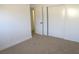 Bedroom featuring carpeted floors, closet, and white walls at 4816 Greencreek Dr, Las Vegas, NV 89110