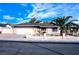 Single-story home featuring an attached garage, desert landscaping, and a secure front yard at 4816 Greencreek Dr, Las Vegas, NV 89110