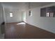 Spacious living room featuring tile flooring, windows, and ceiling fans at 4816 Greencreek Dr, Las Vegas, NV 89110