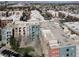 Aerial view of multi-story buildings, landscaping, and parking areas within the condominium complex at 50 E Serene Ave # 123, Las Vegas, NV 89123