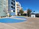 Community basketball court with new surface, next to building at 50 E Serene Ave # 123, Las Vegas, NV 89123