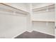 Walk-in closet with a single shelf and neutral carpet at 50 E Serene Ave # 123, Las Vegas, NV 89123