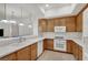 Spacious kitchen with wooden cabinets, white countertops, and modern appliances at 50 E Serene Ave # 123, Las Vegas, NV 89123