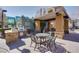 Outdoor kitchen area with built-in grill and seating, ideal for entertaining at 50 E Serene Ave # 123, Las Vegas, NV 89123