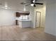 Open kitchen with stainless appliances, island, and a view of living room at 5121 Lindell Rd # 104, Las Vegas, NV 89118