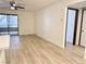 Open living room with a kitchen island and sliding glass door to the balcony at 5121 Lindell Rd # 104, Las Vegas, NV 89118