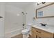 Updated bathroom with modern fixtures, stylish vanity, and tiled floor at 5394 Swenson St # 29, Las Vegas, NV 89119