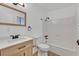 Bright bathroom features wood-look floors, stylish vanity and sink, modern fixtures, and a shower-tub combination at 5394 Swenson St # 29, Las Vegas, NV 89119