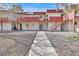 Two-story apartment building showcasing accessible entries, pedestrian walkways, and mature landscaping at 5394 Swenson St # 29, Las Vegas, NV 89119