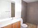 Bathroom featuring a shower, toilet, sink, and vanity at 5490 Floating Flower Ave, Las Vegas, NV 89139