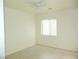 Bedroom featuring a ceiling fan, window, and light wood flooring at 5490 Floating Flower Ave, Las Vegas, NV 89139