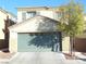 Two-story home featuring a spacious two-car garage, neutral stucco and trim, and low-maintenance landscaping at 5490 Floating Flower Ave, Las Vegas, NV 89139