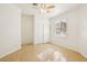 Bedroom with wood laminate floors, a ceiling fan, and a sliding door closet at 5517 Whiteleaf Ct, Las Vegas, NV 89149