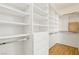 Walk-in closet with custom shelving and built-in drawers for maximum storage at 5517 Whiteleaf Ct, Las Vegas, NV 89149