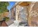 Front entrance featuring a security gate and covered walkway at 5517 Whiteleaf Ct, Las Vegas, NV 89149