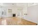 Bright living room with hardwood floors, fireplace, and built-in shelving at 5517 Whiteleaf Ct, Las Vegas, NV 89149