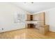 Bright living area with hardwood floors, window shutters, and built-in cabinetry at 5517 Whiteleaf Ct, Las Vegas, NV 89149