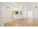 Living room with tile floors and lots of light coming in from the kitchen at 5517 Whiteleaf Ct, Las Vegas, NV 89149