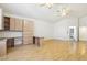 Bright living area with hardwood floors and built-in cabinets with dual workstations at 5517 Whiteleaf Ct, Las Vegas, NV 89149