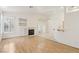 Bright living room with hardwood floors, fireplace and white shutters for natural light at 5517 Whiteleaf Ct, Las Vegas, NV 89149