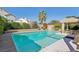 Beautiful backyard pool and spa with a covered gazebo and lush landscaping, perfect for outdoor enjoyment at 5517 Whiteleaf Ct, Las Vegas, NV 89149