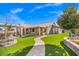 A beautiful backyard featuring a covered patio and manicured lawn, perfect for outdoor relaxation at 6316 Canyon Ridge Dr, Las Vegas, NV 89108