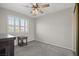 Cozy bedroom with neutral carpet, shuttered windows, and side table at 6316 Canyon Ridge Dr, Las Vegas, NV 89108