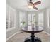 Bright dining area with a modern ceiling fan, tiled floor and three large windows at 6316 Canyon Ridge Dr, Las Vegas, NV 89108