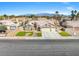 A well-maintained home with a spacious three-car garage, desert landscaping, and a welcoming entrance at 6316 Canyon Ridge Dr, Las Vegas, NV 89108