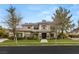 Elegant two-story home featuring manicured landscaping and a stately entrance at 632 Canyon Greens Dr, Las Vegas, NV 89144