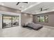 Serene bedroom with a platform bed, balcony access, and large windows offering natural light and views at 632 Canyon Greens Dr, Las Vegas, NV 89144