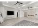 Expansive bedroom with a modern fireplace, built-in entertainment center, and neutral color palette at 632 Canyon Greens Dr, Las Vegas, NV 89144