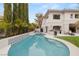 Backyard pool and spa area with elegant tile and landscaping create a relaxing oasis at 632 Canyon Greens Dr, Las Vegas, NV 89144