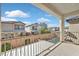 A large, sunlit balcony offers a view of the home's backyard and nearby properties at 6489 Little Harbor Ct, Las Vegas, NV 89141