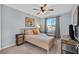 Comfortable bedroom with ceiling fan, window, and closet with neutral decor at 6489 Little Harbor Ct, Las Vegas, NV 89141