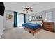 Spacious bedroom featuring a ceiling fan and a comfortable bed with curtains at 6489 Little Harbor Ct, Las Vegas, NV 89141