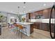 Contemporary kitchen with stainless steel appliances and an island with seating at 6489 Little Harbor Ct, Las Vegas, NV 89141