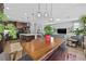 Open concept living room and kitchen area with natural lighting and modern light fixtures at 6489 Little Harbor Ct, Las Vegas, NV 89141