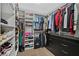 Large walk-in closet with custom shelving, closet organizer, and hanging racks at 6489 Little Harbor Ct, Las Vegas, NV 89141