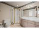 Bathroom featuring large mirror, vanity, tile flooring, and stand up shower at 701 Aztec Cir, Mesquite, NV 89027