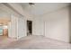 Spacious bedroom featuring plush carpet and doorways to other rooms at 701 Aztec Cir, Mesquite, NV 89027