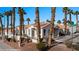 Beautiful Desert community homes with lush palm trees, desert landscaping, and sidewalk appeal at 701 Aztec Cir, Mesquite, NV 89027