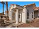 Charming single-story home featuring stucco walls, tile roof, and desert landscaping at 701 Aztec Cir, Mesquite, NV 89027