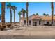 Charming Desert community home with lush palm trees and white picket fences for relaxed curb appeal at 701 Aztec Cir, Mesquite, NV 89027