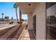 Charming home exterior with desert landscaping and covered porch entry for curb appeal at 701 Aztec Cir, Mesquite, NV 89027