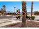 Street view of desert landscape with mountain view and crosswalk stop sign at 701 Aztec Cir, Mesquite, NV 89027