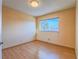 Well lit bedroom with hardwood floors and a view out the bright window at 7117 Shadow Crest Dr, Las Vegas, NV 89119