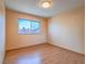 Neutral bedroom featuring a large window with a view of the neighborhood at 7117 Shadow Crest Dr, Las Vegas, NV 89119