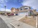 Front exterior of a gray two-story home with an attached two-car garage at 7117 Shadow Crest Dr, Las Vegas, NV 89119