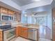 Kitchen featuring stainless steel appliances and wood cabinets at 7117 Shadow Crest Dr, Las Vegas, NV 89119